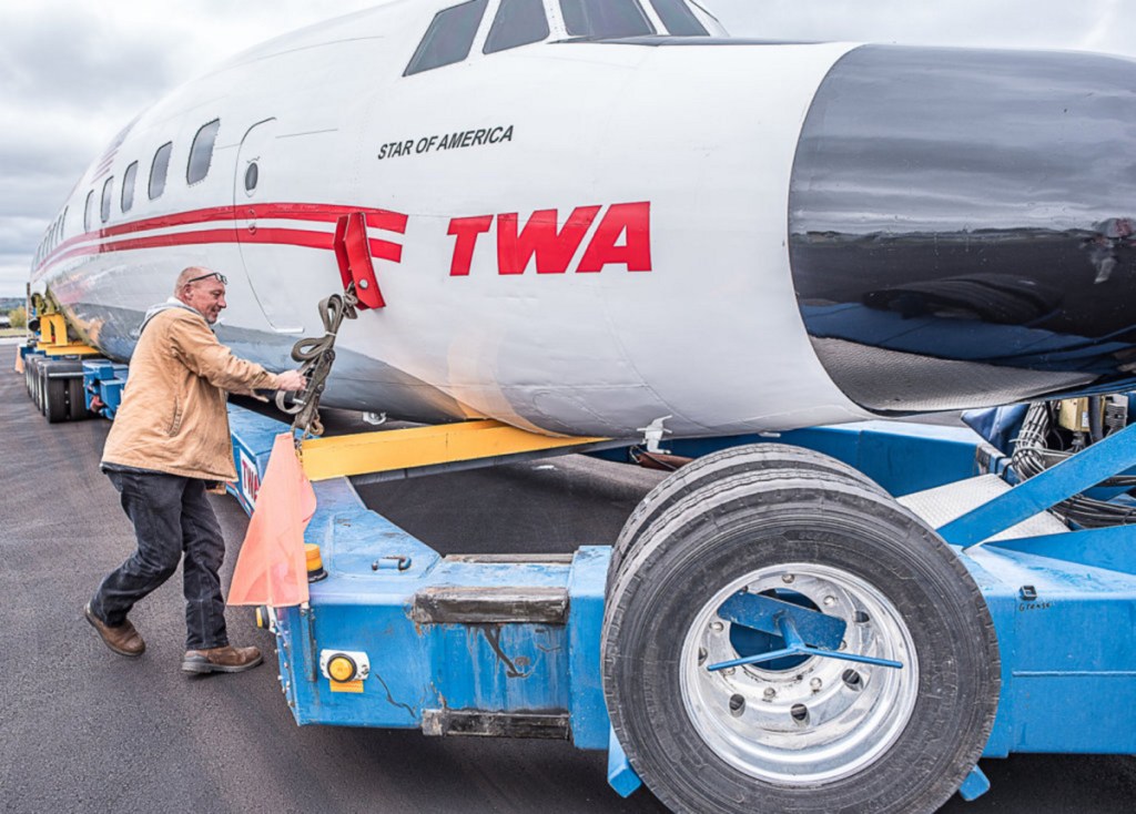 Marty Batura of Worldwide Aircraft Recovery checks the rigging on the body of the "Super Star" aircraft, which will start the 328-mile journey to Queens at 7 a.m. Tuesday. "There's going to be a lot of double-takes" by onlookers, he said.