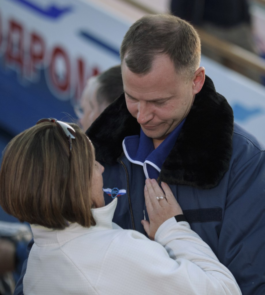 Expedition 57 Flight Engineer Nick Hague of NASA embraces his wife, Catie, on Thursday.