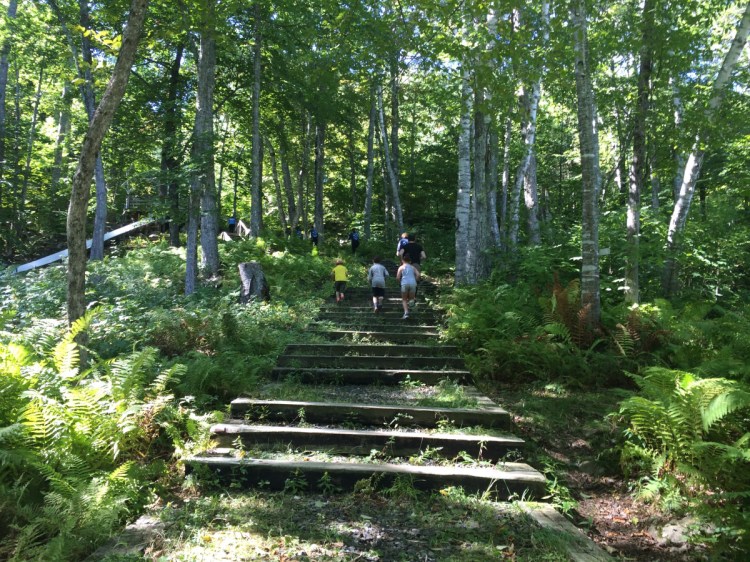 The Fifth Annual Ragged Mountain Scuttle at the Camden Snow Bowl involved 22 obstacles spread across a 3.1-mile course that ran up the ski mountain, including along the Snow Bowl toboggan chute, shown here to the left.