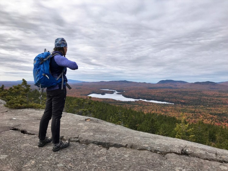 Jenny Ward enjoys the big view from the AT on Monument Cliff -   Carey Kish photo