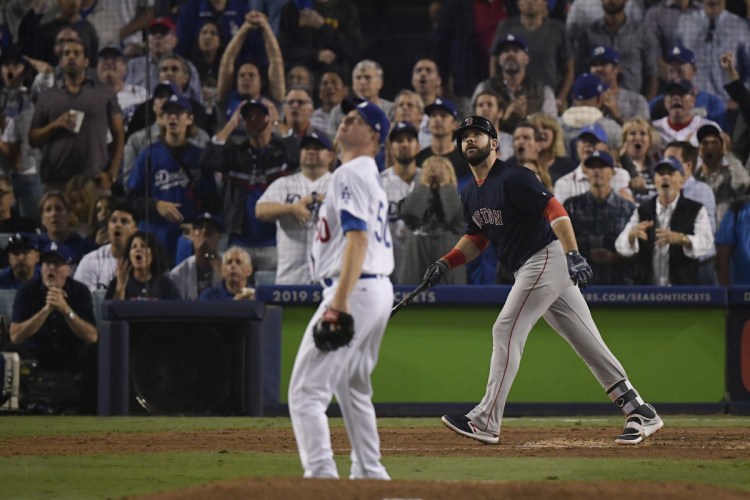 Boston's Mitch Moreland watches his three-run home run off Los Angeles relief pitcher Ryan Madson during the seventh inning.