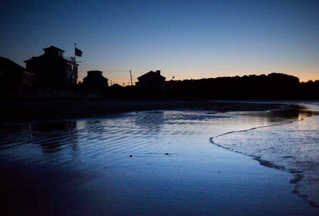 Homes remain dark just before sunrise on Tuesday morning at Higgins Beach after powerful winds knocked out power to many communites in Southern Maine. 