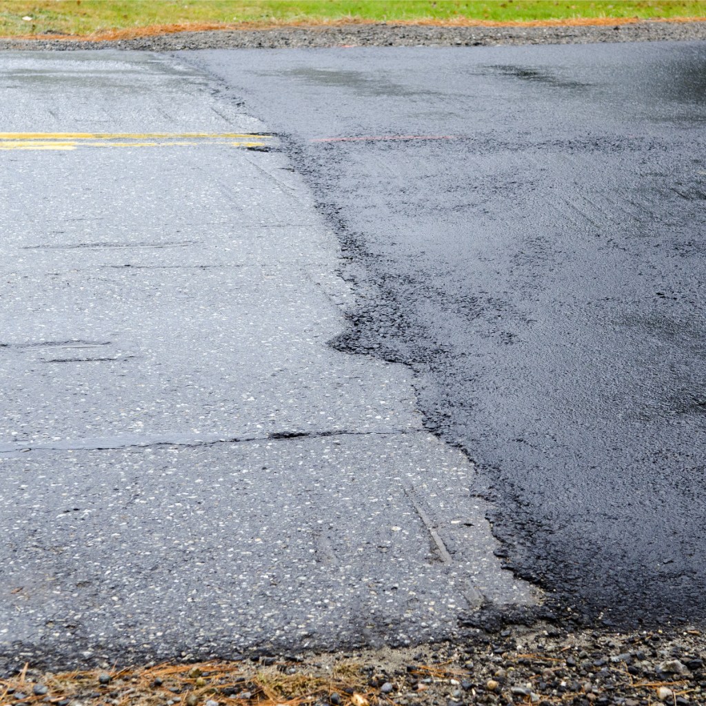 The old section of Northern Avenue in Farmingdale, at left, seen Thursday, is slightly higher than the new, darker pavement level on a recently repaired section of the avenue.