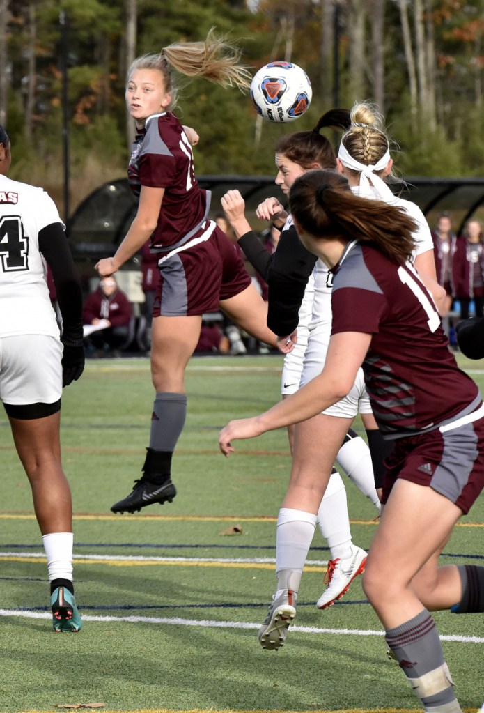 Staff photo by David Leaming 
 UMF's Fern Calkins, center, heads the ball during a game against Thomas College in the North Atlantic Conference championship game Sunday in Waterville.