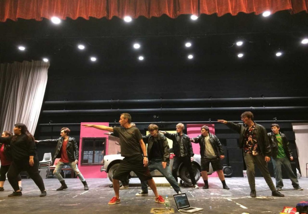 Waterville High School Drama students with choreographer Scott Stevens practice the song and dance "Grease Lightning." Front from left are Angieh Davila, Stevens, Elwin Moss and Tait Blethen. In back, from left, are Hannah Hall, Kolby Lovett, David Barre (behind Stevens), Blaine Bickford, Owen Evens and Vincent Palmer.