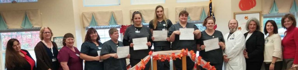 From left are Athena Briggs, WMCA Employment & Training Specialist; Robin Doody, NLH Talent Acquisitions Specialist; Lynn Pagliaro, R. N. Clinical Instructor; CNA graduates Billie Jo Ramsdell, Victoria Huff, Jessica Downs, Summer Ogden, Mary Ellen Goneau and Makayla Coyne; Chris Miller, R. N. Class/Clinical Instructor; Monica Millhime, WMCA Employment & Training Business Specialist; Shannon Lockwood, NLH Administrator; and Patricia Shuck, R. N. Director of Nursing. CNA graduate Susan Moody not pictured.