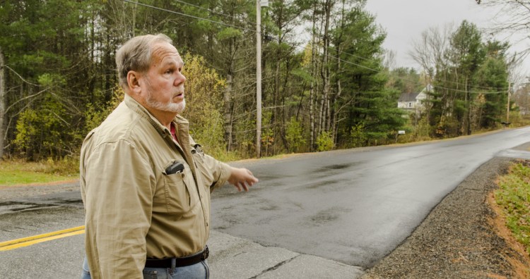 Farmingdale Road Commissioner Steve Stratton talks about the pavement level on a recently repaired section of Northern Avenue on Thursday in Farmingdale.