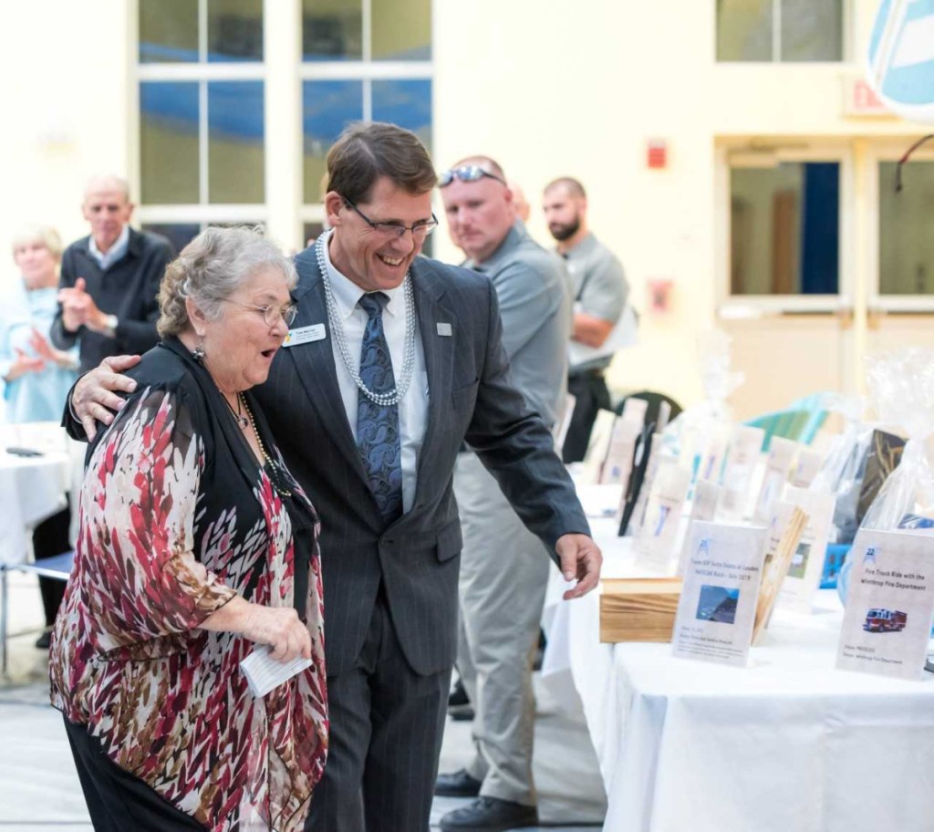 Charlene Bridge, left, was recognized as the 10th John Bridge Award Recipient during the Kennebec Valley YMCA 11th annual Auction Oct. 6. Kennebec Valley YMCA CEO, Tom Warren, is at her right.