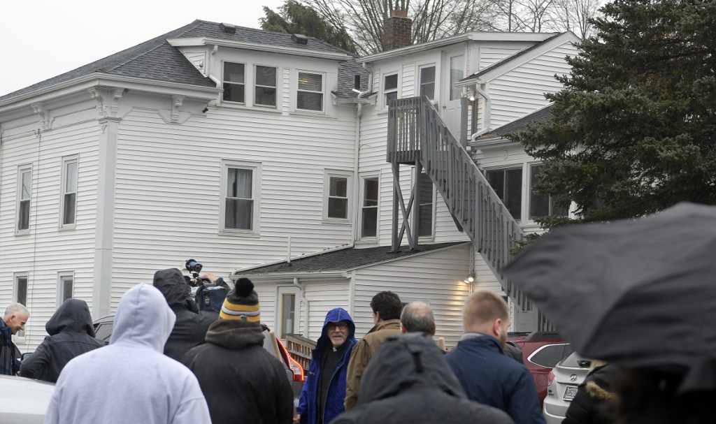 People gather Tuesday outside the Bread of Life Shelter in Augusta to celebrate an forthcoming expansion of the homeless shelter.