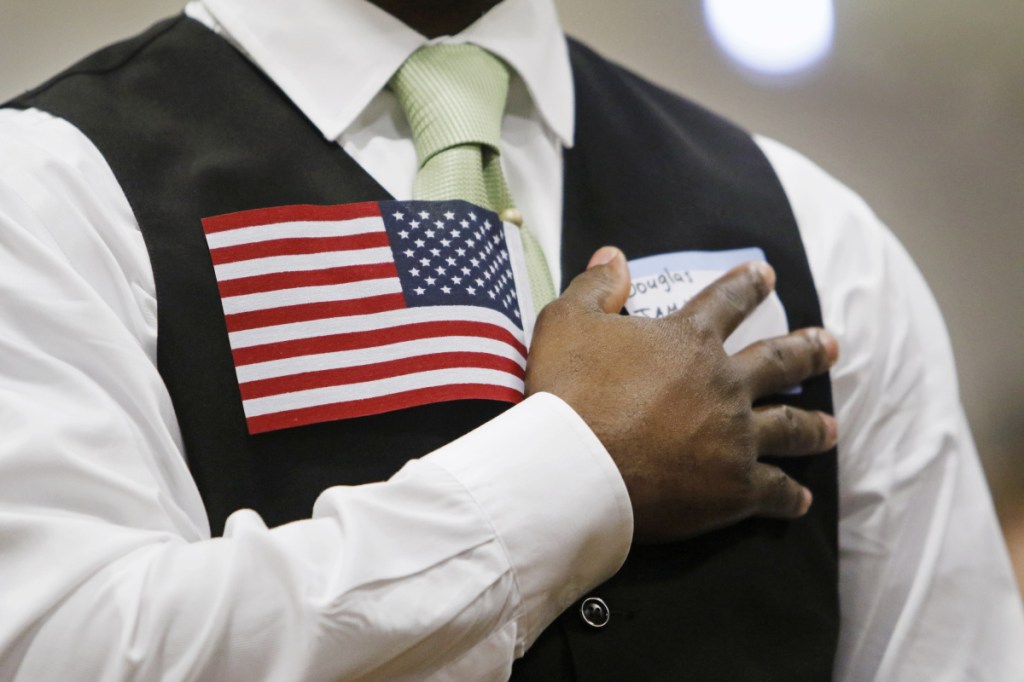 Three-quarters of a million foreign-born legal residents, who have met all the legal requirements, are stuck waiting behind an invisible wall that stands between them and citizenship.
