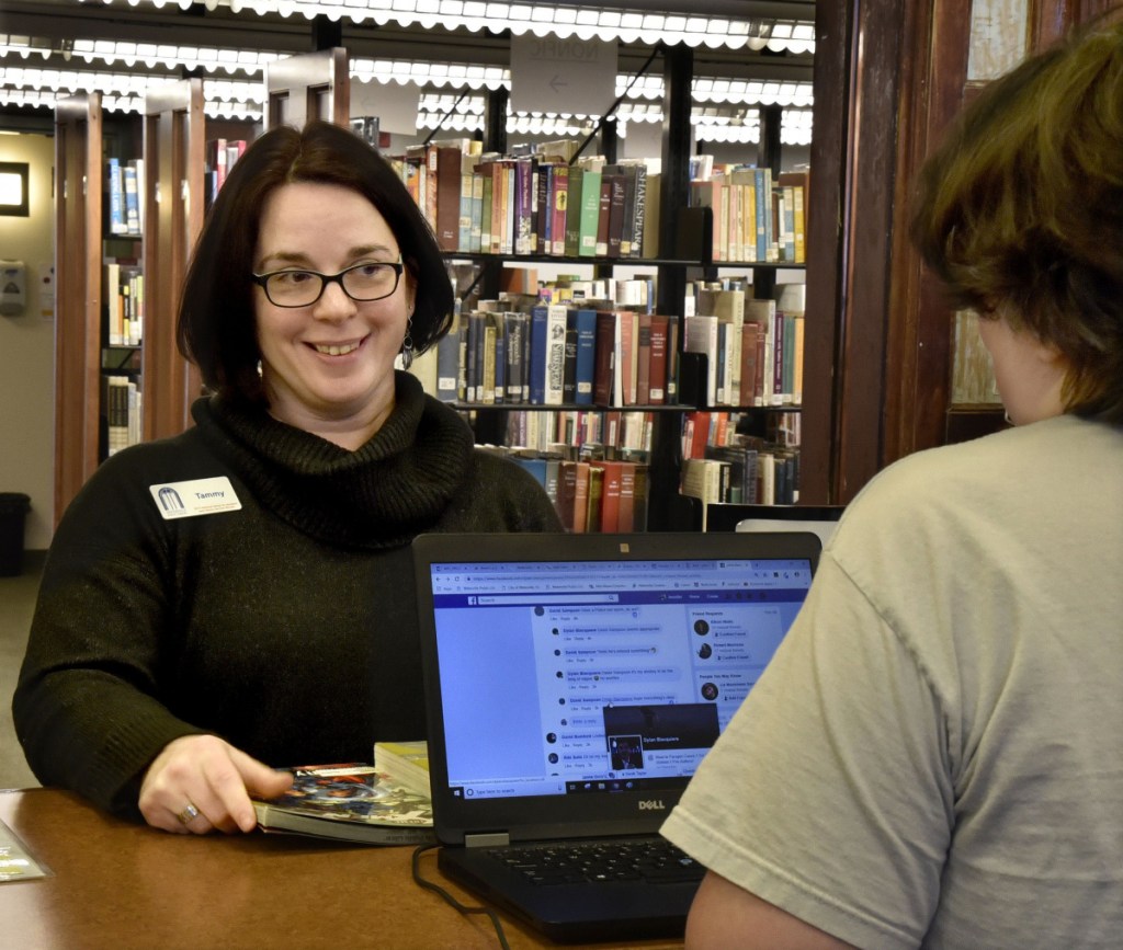 Tammy Rabideau, left, the new director of the Waterville Public Library, speaks with librarian Jennifer De Salme at the main desk on Wednesday. Rabideau created the library's Business, Career, & Creativity Center and has worked with the Chamber of Commerce and other groups on employment-related programs that support local job-seekers.