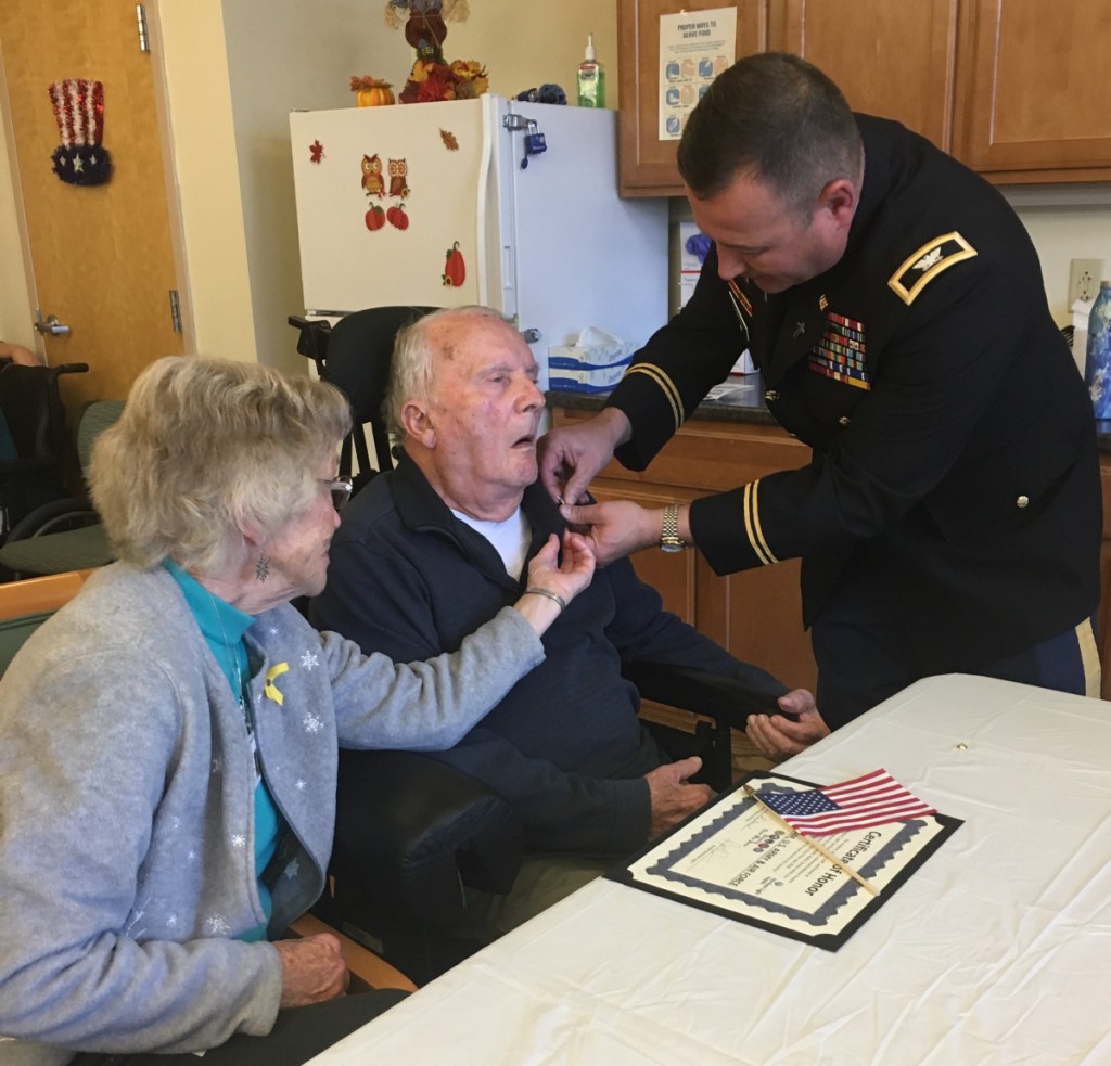 Col. Andrew Gibson with veteran Russ Perham and his wife Fay.