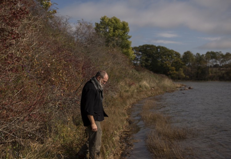 Kelly Thorndike, an artist and veteran of the Iraq war, stands along the banks of the St. Georges River in Thomaston. Thorndike suffered a traumatic brain injury in the war and has struggled with PTSD, he uses art as a way to help him and other veterans cope and is starting the St. Georges River Veteran's art project.