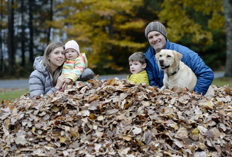 The Hartman family poses for a photograph with their dog Stella, who is an Instagram celebrity. From left are Juliet; Hannah, 1; Lucas, 5; and Jody Hartman. (Staff photo by Shawn Patrick Ouellette)