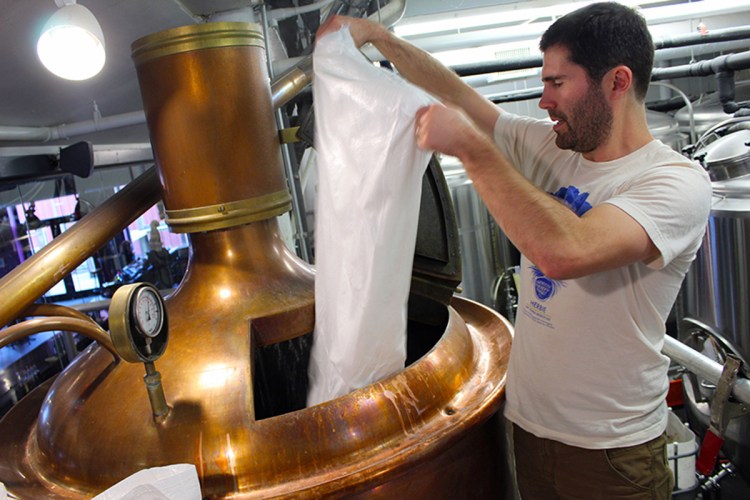 Liquid Riot head brewer Greg Abbot making Resilience IPA, part of a collective nationwide craft brew effort to help wildfire victims in California.