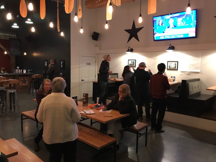 Supporters of Question 1 met Tuesday night at Stroudwater Distillery in Portland to watch the election results.