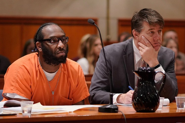 David Marble and his lawyer Jon Gale listen to Deputy Attorney General Lisa Marchese at the start of Marble’s sentencing at the Cumberland County Courthouse in Portland on Friday. 