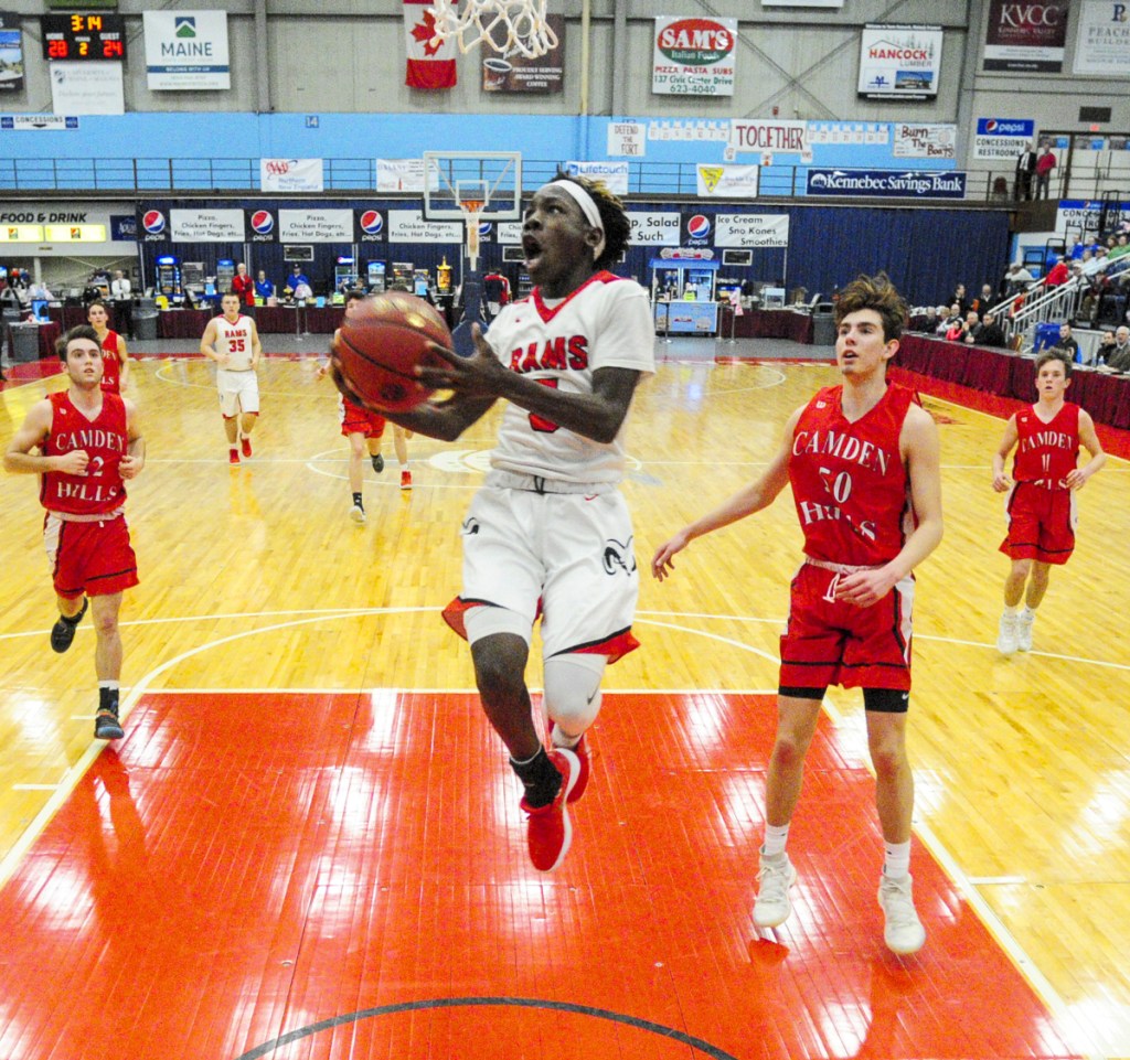 Cony guard Simon McCormick heads to the basket during a Class A North quarterfinal game against Camden last season at the Augusta Civic Center. McCormick and the Rams look to contend in Kennebec Valley Athletic Conference Class A this season.