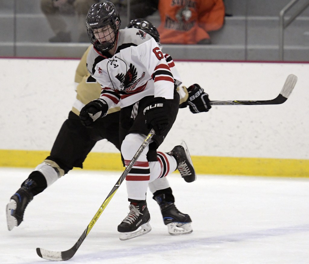 The Kings' Cole Gagne can't stop the Hawks' Coleman Watson from crossing the blue line during a game Monday in Readfield.