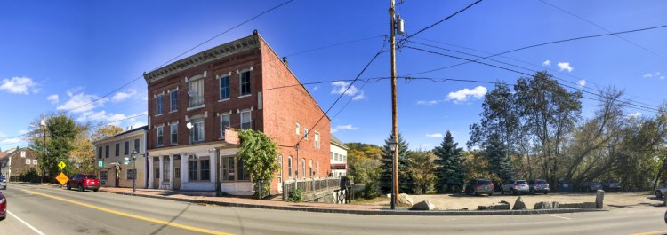 A new sidewalk, shown Oct. 22, ends at the Lucky Garden restaurant parking lot on Water Street in downtown Hallowell.