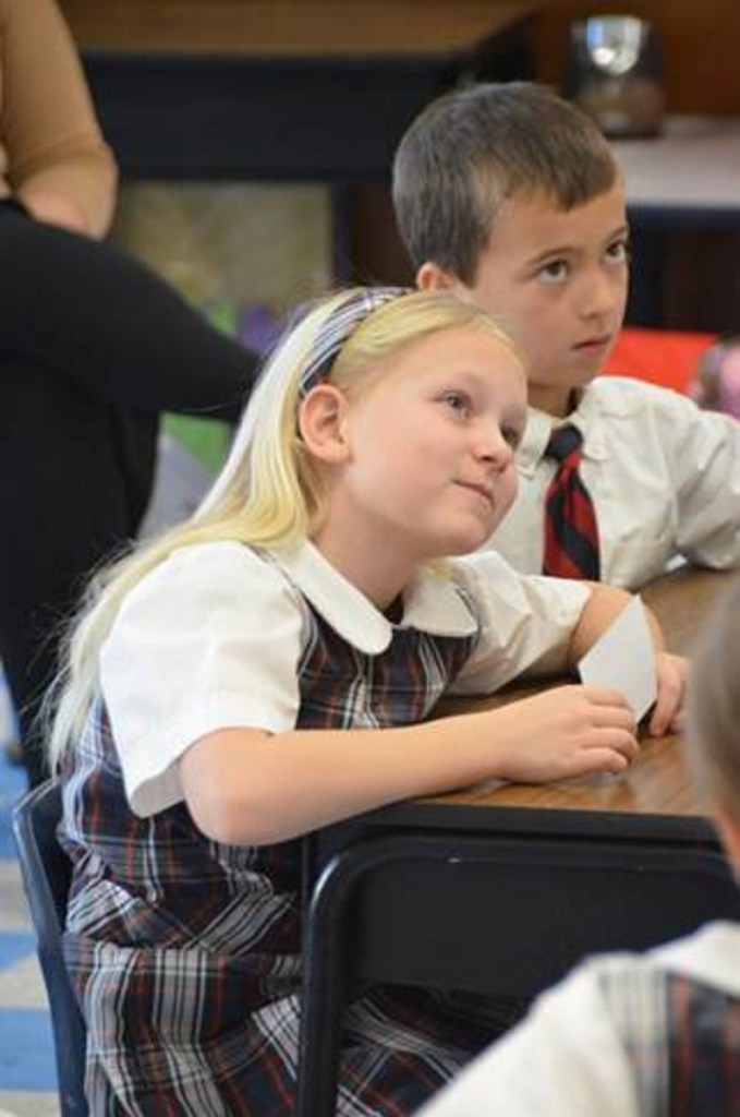 Kennedy Dube, left, with Aiden Therrien, second-grade students at St. Michael School in Augusta.