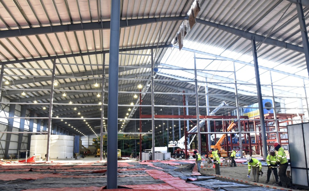 Workers continue construction inside the three-acre Fiberight Corp. solid waste processing and recycling facility in Hampden on Thursday.