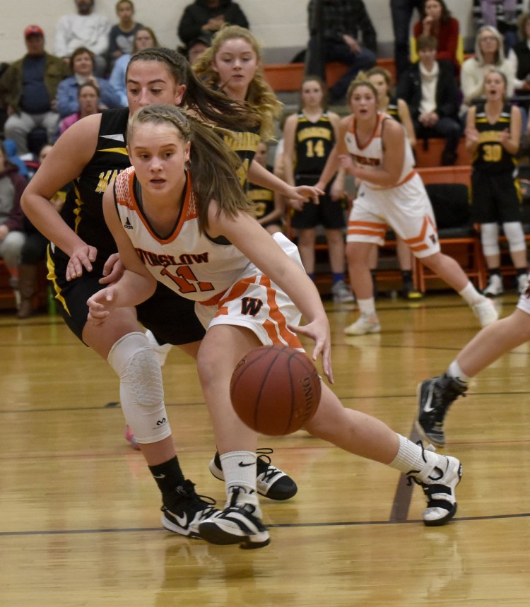 Winslow's Silver Clukey dribbles upcourt against Maranacook during a Kennebec Valley Athletic Conference game Tuesday in Winslow.