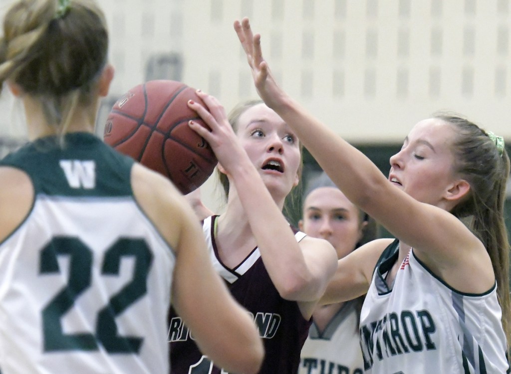 Winthrop's Madison Forgue guards Richmond's Hannah Moholland during a Mountain Valley Conference game Wednesday in Winthrop.