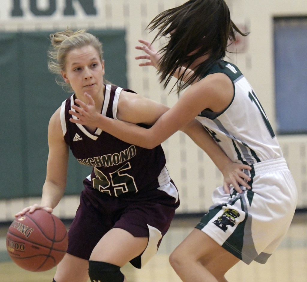 Winthrop's Jillian Schmelzer, right, guards Richmond's Caitlin Kendrick during a Mountain Valley Conference game Wednesday in Winthrop.