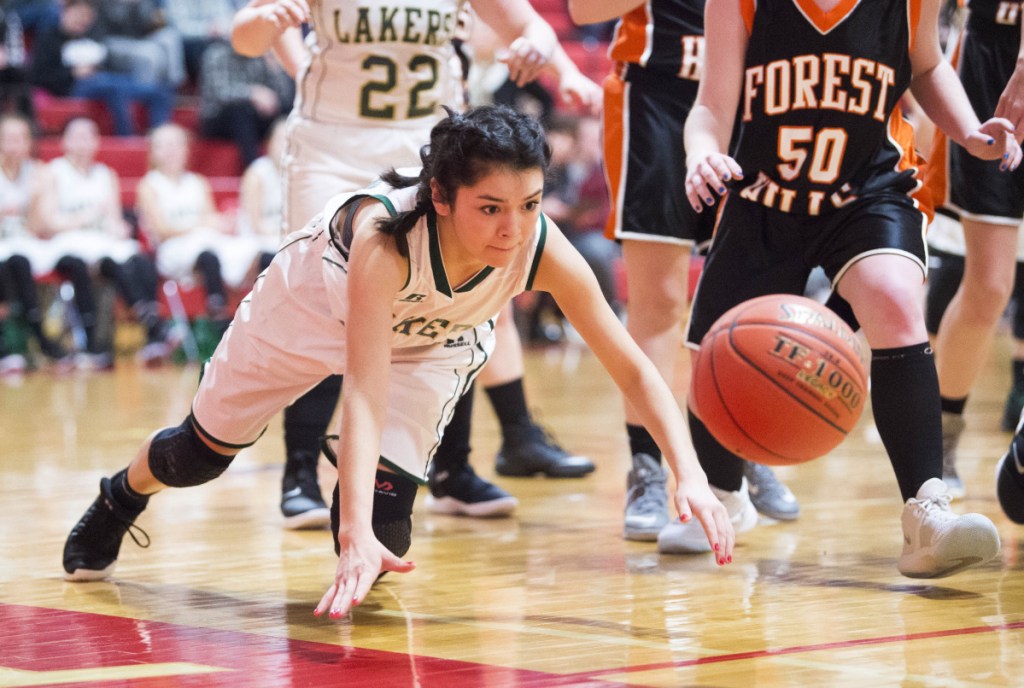 Rangeley's Toni Almeraz (24) dives to save the ball against Forest Hill on Saturday at Cony High School in Augusta.