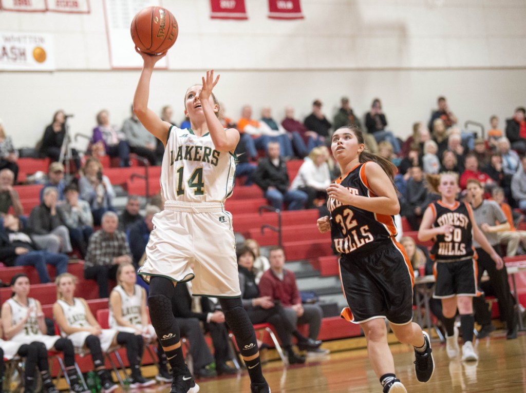 Rangeley's Emily Eastlack (14) goes in for the easy layup against Forest Hills on Saturday at Cony High School in Augusta.