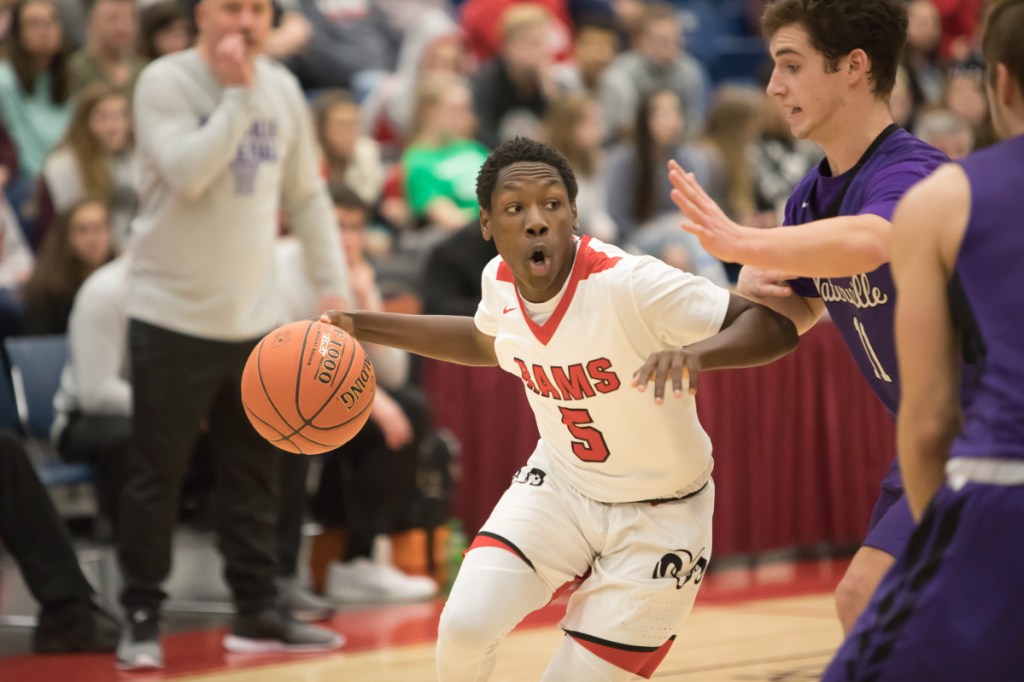 Cony's Simon McCormick drives the ball to the basket against Waterville during the Captial City Hoop Classic on Saturday at the Augusta Civic Center.