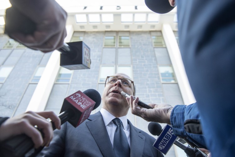 Lee Goodman, center, attorney for Rep. Bruce Poliquin, speaks to the media after a Nov. 13 hearing at the U.S. District Court in Bangor on ranked-choice voting in the 2nd Congressional District race. Staff photo by Michael G. Seamans