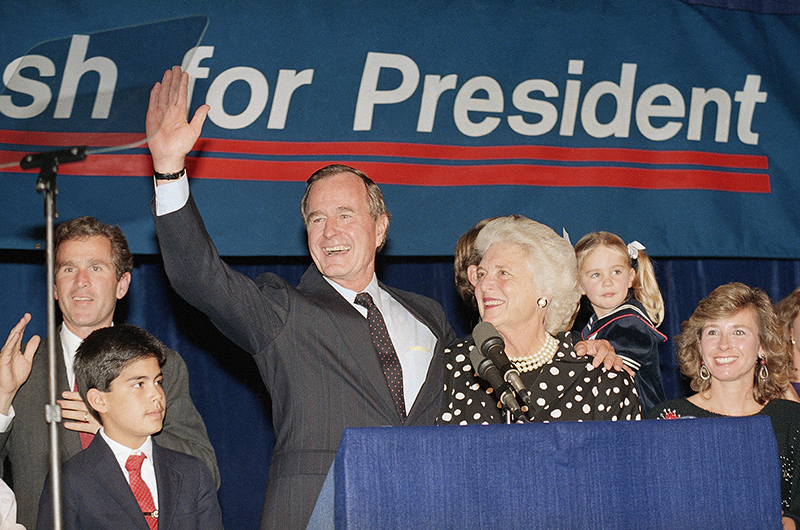Vice President George Bush and wife, Barbara, wave to supporters who turned out in Houston on Oct. 12, 1987, to hear him announce he was a candidate for the Republican nomination for president of the United States.