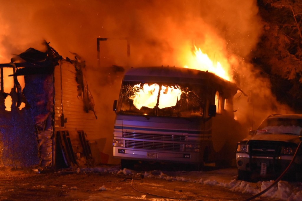 A garage at 107 Benson Road in West Gardiner was fully engulfed in flames when firefighters arrived shortly after 11 p.m. Wednesday. The fire destroyed the three cars in the garage, a recreational vehicle and a pickup truck parked outside; and it damaged a work van and the side of the house.