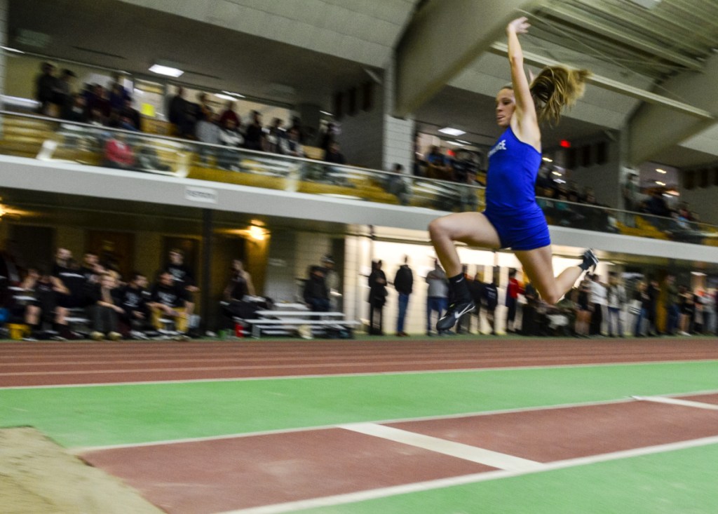 Kennebec Journal photo by Joe Phelan 
 Lawrence's Payton Goodwin takes off during the triple jump Saturday at Bowdoin College in Brunswick.