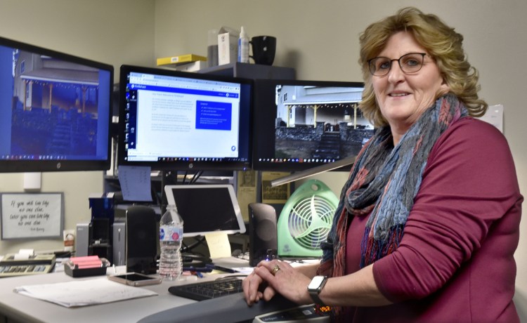 Lori Faulkner, School Administrative District 49 director of technology, stands in her office Tuesday at Lawrence Junior High School in Fairfield. Under the restructuring of administration in the district, Faulkner will be given a new job title and job description as well as a raise.