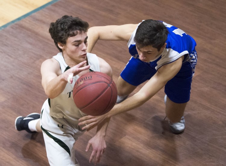 Temple Academy's Noah Shepherd (14) left, tries to dribble past Valley  defender Zachary Walter (11) on Thursday in Waterville.