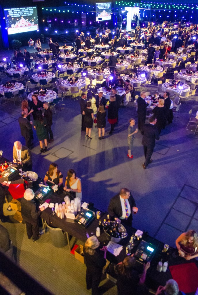 People socialize before the Kennebec Valley Chamber of Commerce's Kenney Awards dinner on Friday at the Augusta Civic Center.