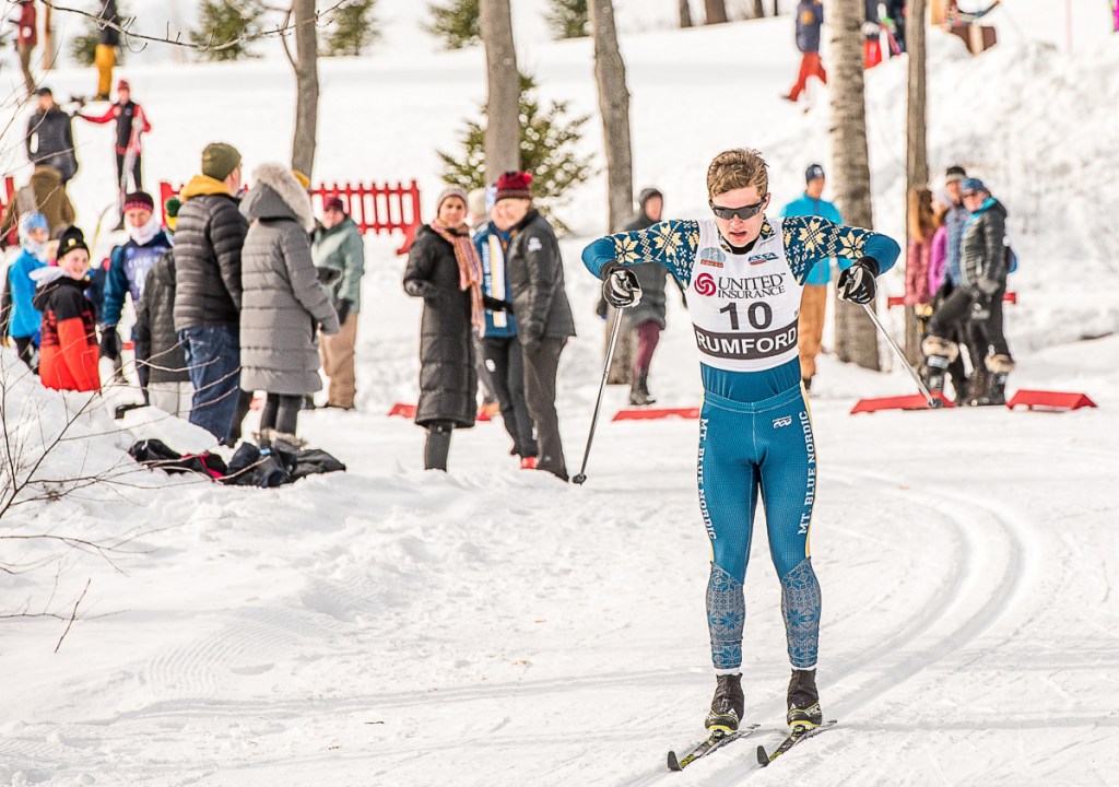 Mt. Blue's Sam Smith double poles down the first hill at the Sassi Memorial 5K classical race Saturday at Black Mountain in Rumford.