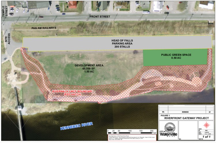 The area Waterville is targeting for development as the Riverfront Gateway Project is between the paved parking lot and the RiverWalk at Head of Falls.
