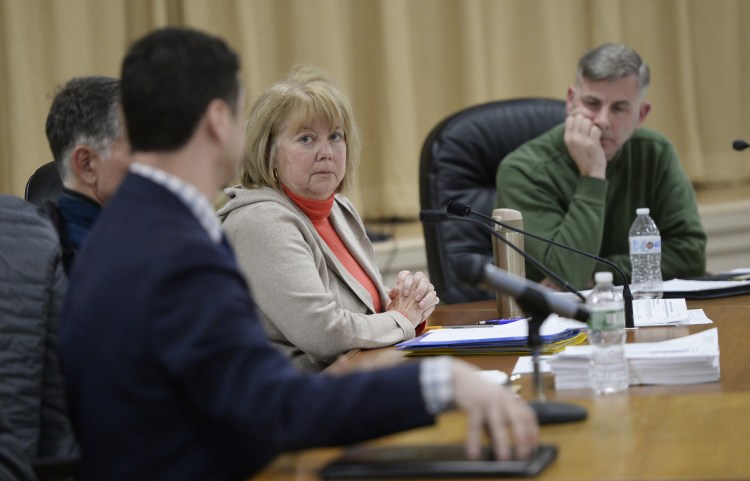 Madeline Mooney, listening to town attorney Philip Saucier at a meeting in January, is one of the Ogunquit Select Board members targeted by a recall petition.