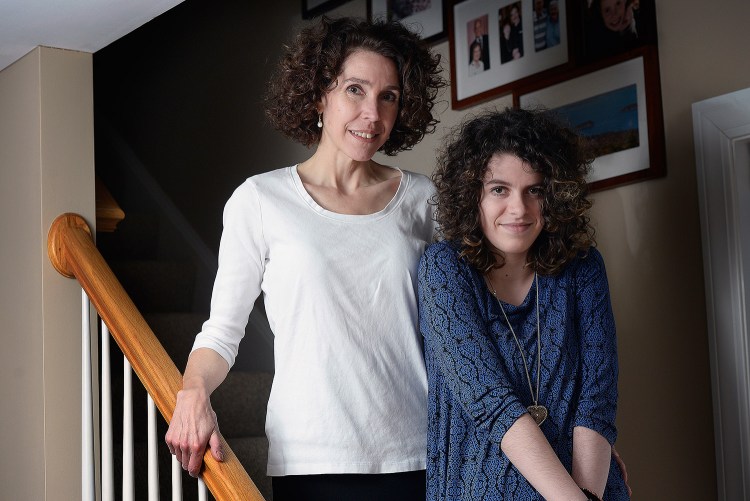 Pictured at their home in Portland, Liv Cooper and her mother, Brooke Cooper, say they battled an insurance company for months to pay for the epilepsy treatment that the teenager's doctor recommended. The process also delayed surgery Liv eventually needed.