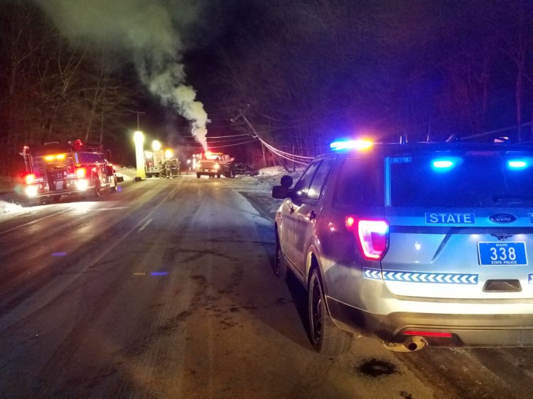 Authorities attend to a fatal crash off Route 133 in Wayne on Friday. Police said Michael Fitzherbert, 35, of Hartford, was killed when his SUV veered off the road and crashed into a utility pole.