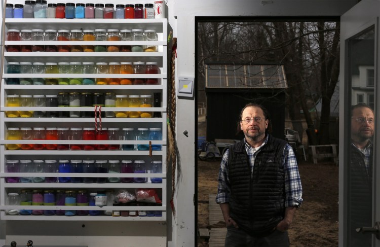 Artist Scott Kelley stands outside his Peaks Island studio last April. Proceeds from Kelley's new book, "I Am Birch," will go to help Wabanaki craftspeople buy raw materials.