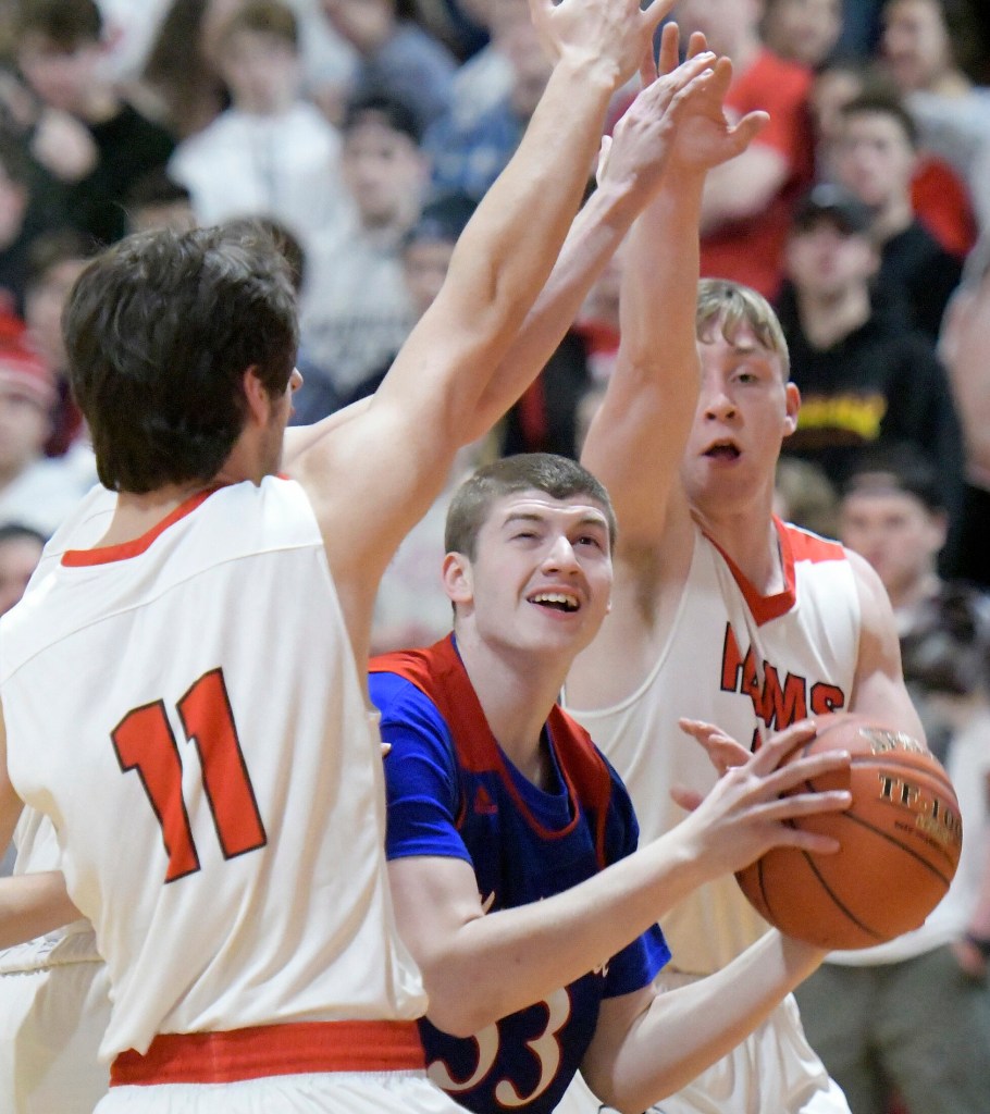 Cony defenders clamp down on Messalonskee's Noah Wood during a Kennebec Valley Athletic Conference Class A game Thursday in Augusta.  