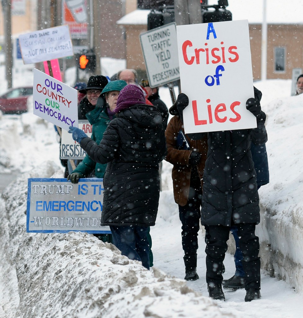 Protestors gather Monday outside the Muskie Federal Building in Augusta to protest the emergency declaration issued by President Donald Trump to create a wall between the United States and Mexico.