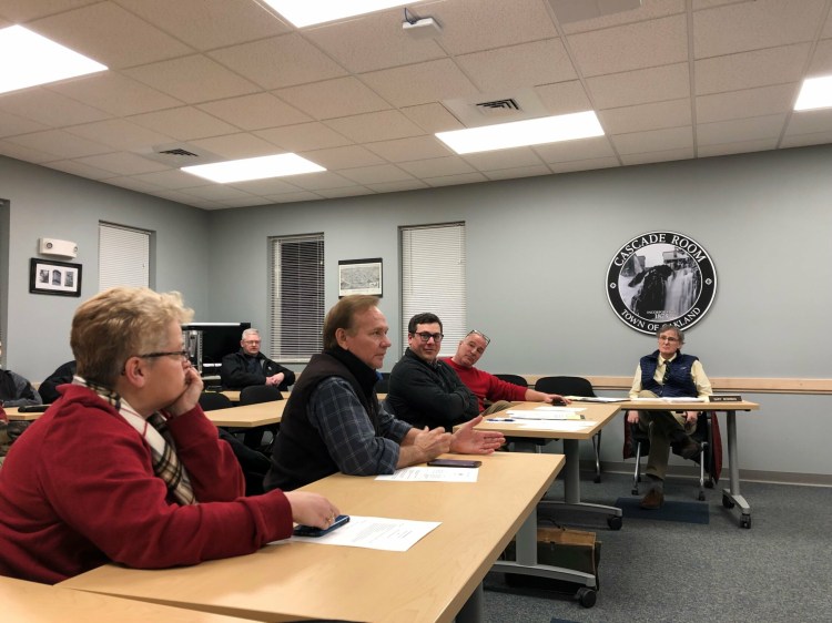 Oakland resident Kelly Roderick, left, listens on Wednesday to Tony Jabar, attorney Andre Duchette and John Jabar, representatives of a company that wants to create a laboratory in Oakland where cannibidiol would be extracted from hemp. Town Manager Gary Bowman watches at right. 