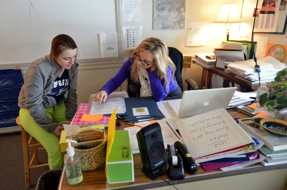 Jennifer Levesque, 17, of Waterville, left, eats some chili cooked during class at the Maine Children’s Home for Little Wanderers on Silver Street in Waterville on Tuesday. Levesque attends the Teen Parent School program at the home. Staff photo by Michael G. Seamans