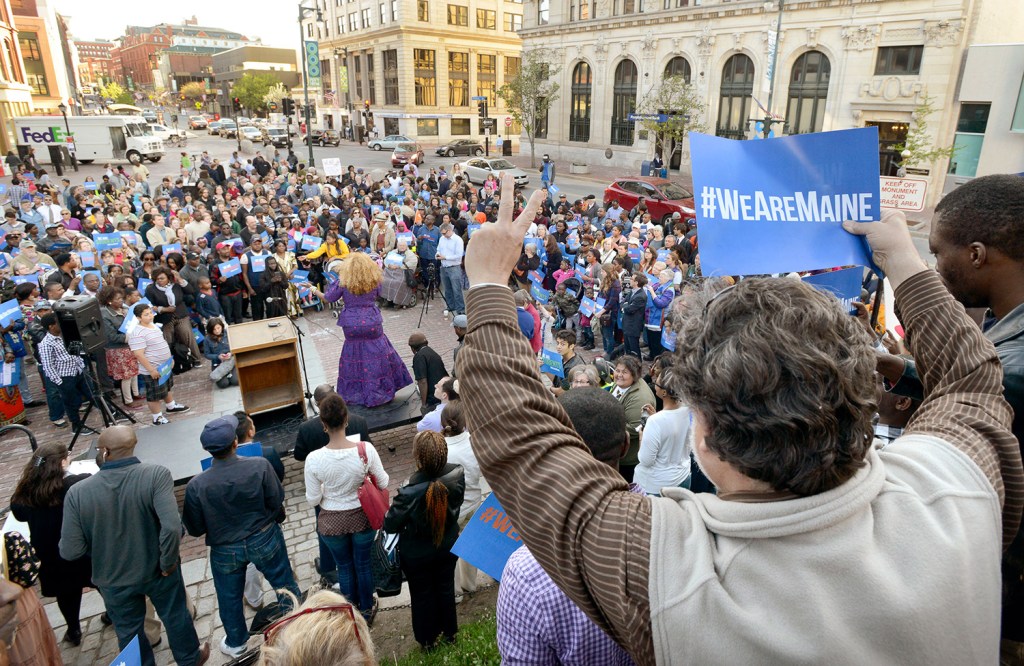 PORTLAND, ME - 2015 file photo: Paul Revier from Portland gives the peace sign from the monument during the "We Are Maine March and Rally" from Lincoln Park to Monument Square in Portland. (Photo by John Patriquin/Staff Photographer)